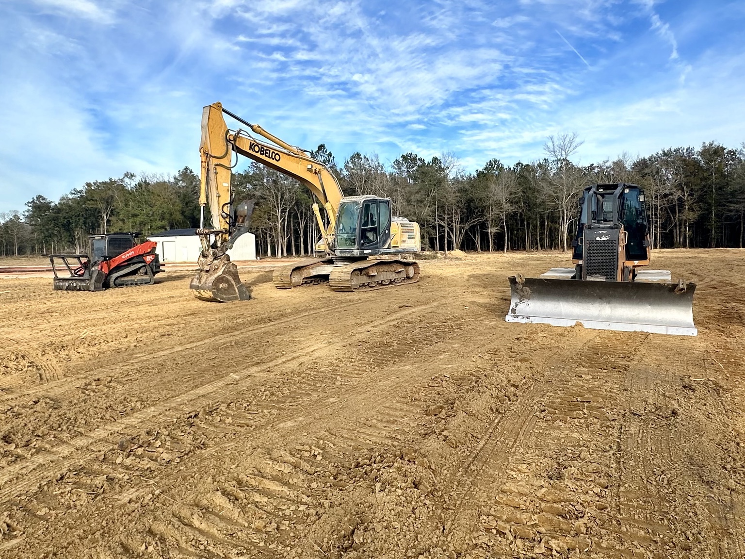 STM Land Management excavator, dozer and skid steer on a cleared jobsite